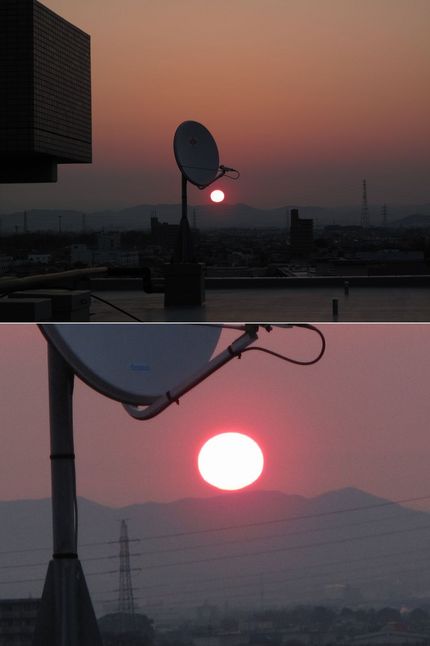 朝日は春霞の中